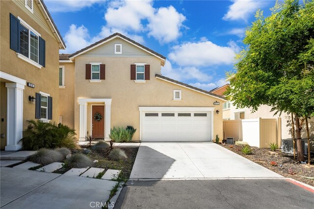 872 Bluebell Way, Beaumont, CA 92223 - view of front of home with stucco siding, driveway, and an attached garage