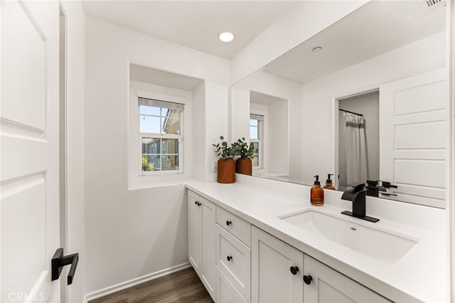 872 Bluebell Way, Beaumont, CA 92223 - bathroom with vanity, wood finished floors, and recessed lighting