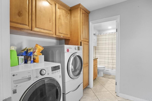 2164 Bluehaven Ct, San Diego, CA 92154 - washroom with washing machine and clothes dryer, light tile patterned flooring, and cabinet space