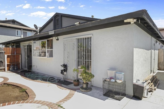 2164 Bluehaven Ct, San Diego, CA 92154 - back of house with a patio, stucco siding, and a gate