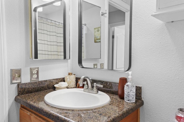 2164 Bluehaven Ct, San Diego, CA 92154 - full bathroom with vanity and a textured wall
