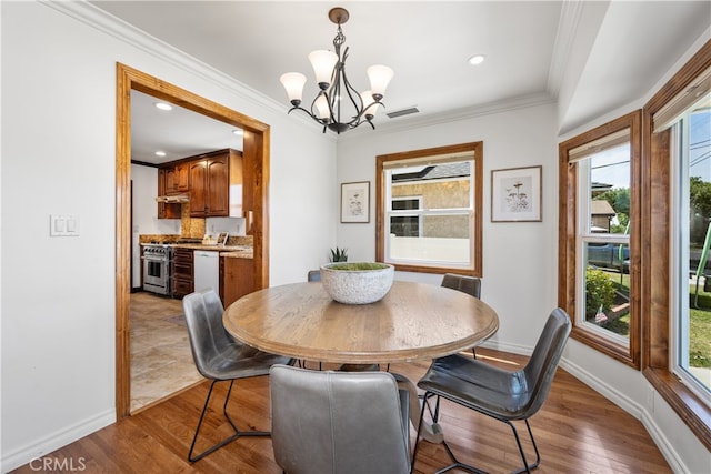 5116 Faust Ave, Lakewood, CA 90713 - dining space with a chandelier, healthy amount of natural light, ornamental molding, light wood finished floors, and recessed lighting