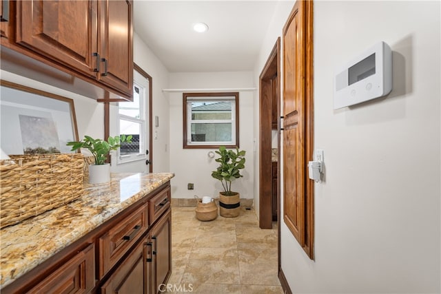 5116 Faust Ave, Lakewood, CA 90713 - doorway with baseboards and light stone finish floors