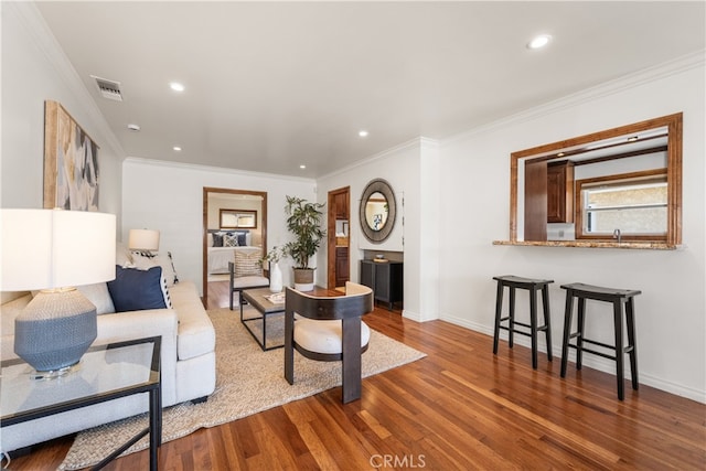 5116 Faust Ave, Lakewood, CA 90713 - living area featuring wood finished floors, ornamental molding, and recessed lighting