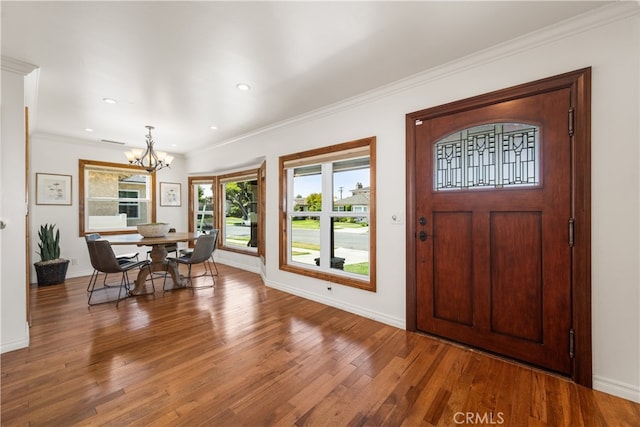 5116 Faust Ave, Lakewood, CA 90713 - foyer with a chandelier, wood finished floors, ornamental molding, and recessed lighting
