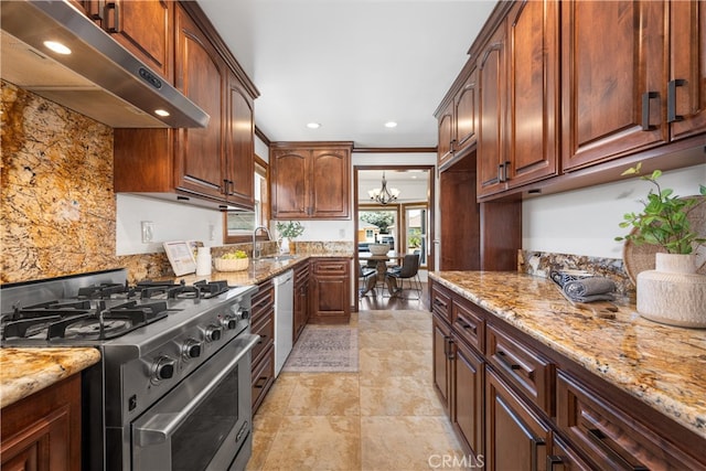 5116 Faust Ave, Lakewood, CA 90713 - kitchen with stainless steel stove, under cabinet range hood, light stone counters, white dishwasher, and recessed lighting