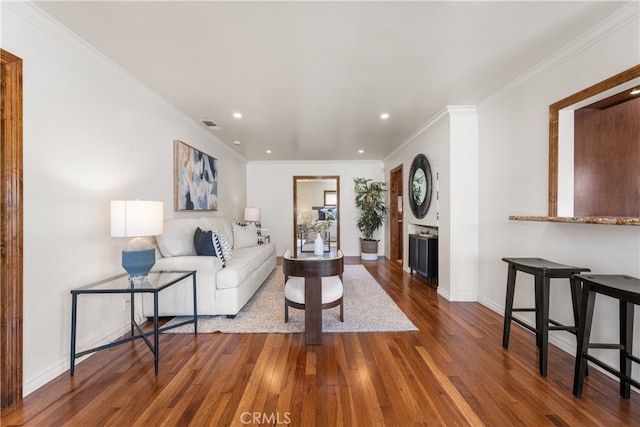 5116 Faust Ave, Lakewood, CA 90713 - living room featuring wood finished floors, recessed lighting, and ornamental molding