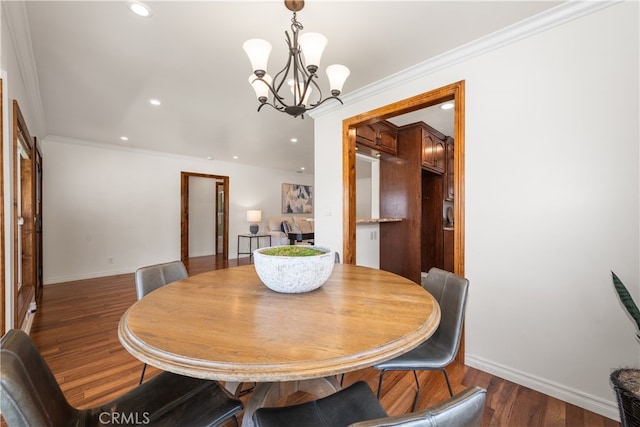 5116 Faust Ave, Lakewood, CA 90713 - dining space with a chandelier, wood finished floors, recessed lighting, and ornamental molding