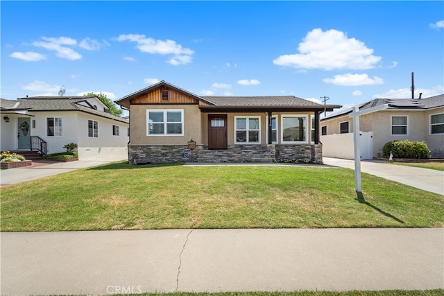 5116 Faust Ave, Lakewood, CA 90713 - view of front of house with stone siding, stucco siding, and driveway