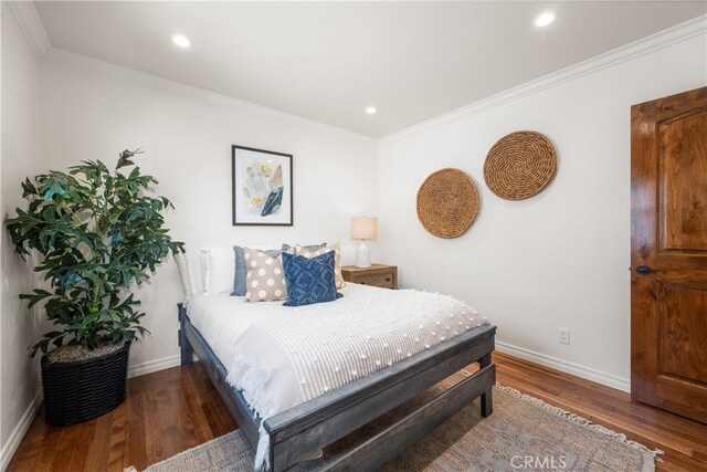 5116 Faust Ave, Lakewood, CA 90713 - bedroom with wood finished floors, crown molding, and recessed lighting