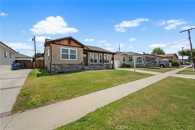 5116 Faust Ave, Lakewood, CA 90713 - view of front of property with stone siding, stucco siding, and a gate