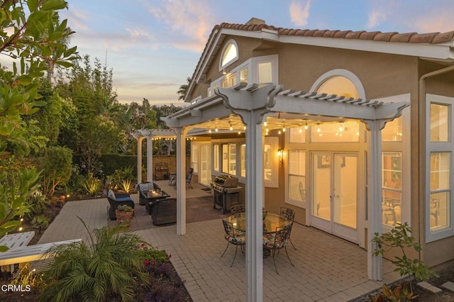 2106 Fox Den Ct, Oxnard, CA 93036 - back of property with a pergola, a patio area, stucco siding, an outdoor hangout area, and a tile roof