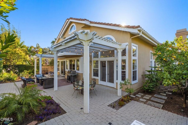 2106 Fox Den Ct, Oxnard, CA 93036 - rear view of house featuring a pergola, stucco siding, a patio, and a tile roof