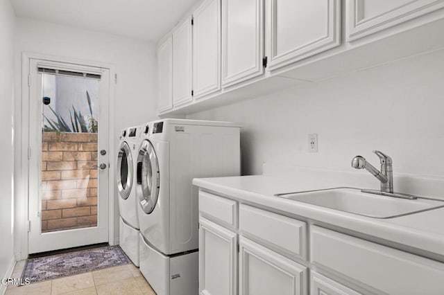 2106 Fox Den Ct, Oxnard, CA 93036 - laundry area featuring cabinet space and independent washer and dryer