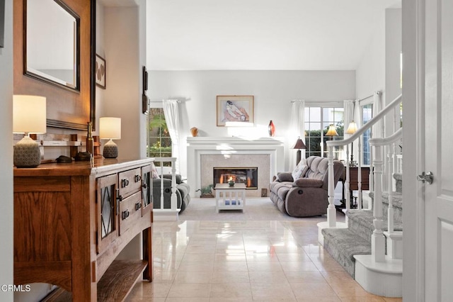 2106 Fox Den Ct, Oxnard, CA 93036 - entryway featuring stairway, a glass covered fireplace, and light tile patterned flooring