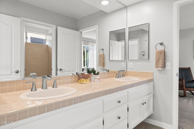 2106 Fox Den Ct, Oxnard, CA 93036 - bathroom featuring double vanity and baseboards