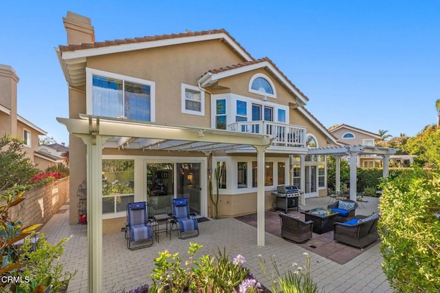 2106 Fox Den Ct, Oxnard, CA 93036 - rear view of property with a chimney, outdoor lounge area, a pergola, a patio area, and stucco siding