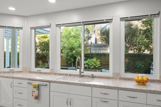 2106 Fox Den Ct, Oxnard, CA 93036 - kitchen with white cabinetry, light stone countertops, and recessed lighting