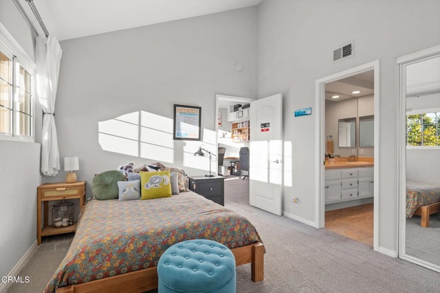 2106 Fox Den Ct, Oxnard, CA 93036 - bedroom featuring light carpet, high vaulted ceiling, and connected bathroom