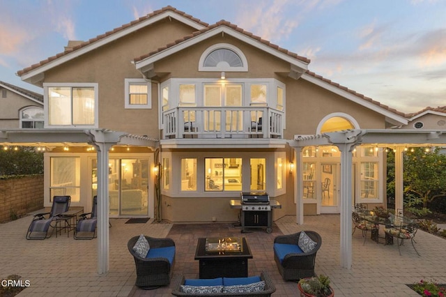 2106 Fox Den Ct, Oxnard, CA 93036 - back of house featuring a balcony, stucco siding, and a patio area