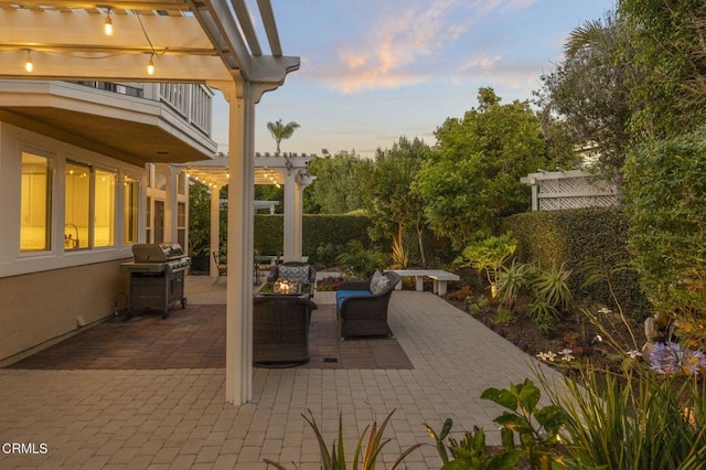 2106 Fox Den Ct, Oxnard, CA 93036 - patio terrace at dusk with a balcony, a pergola, a fire pit, a grill, and a patio