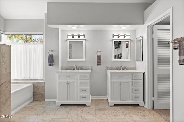 2106 Fox Den Ct, Oxnard, CA 93036 - bathroom with two vanities and a garden tub