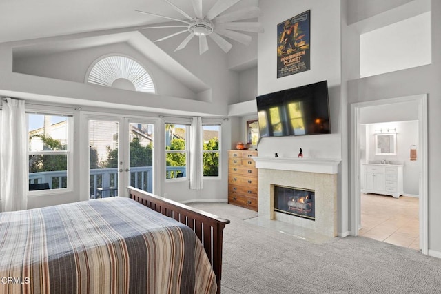 2106 Fox Den Ct, Oxnard, CA 93036 - bedroom featuring carpet, multiple windows, french doors, a fireplace, and high vaulted ceiling