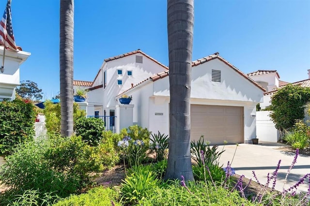 4863 Marathon Way, Oceanside, CA 92056 - view of front of property with driveway, stucco siding, an attached garage, and a tiled roof