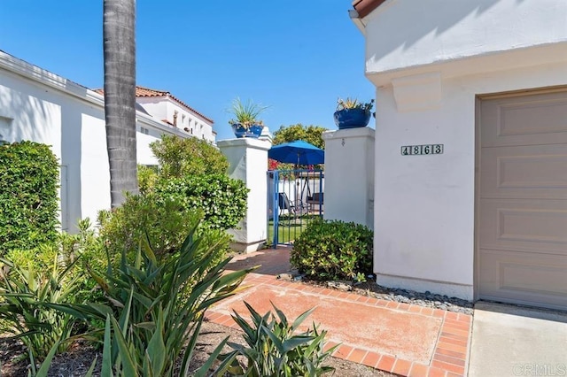 4863 Marathon Way, Oceanside, CA 92056 - entrance to property featuring a garage and stucco siding