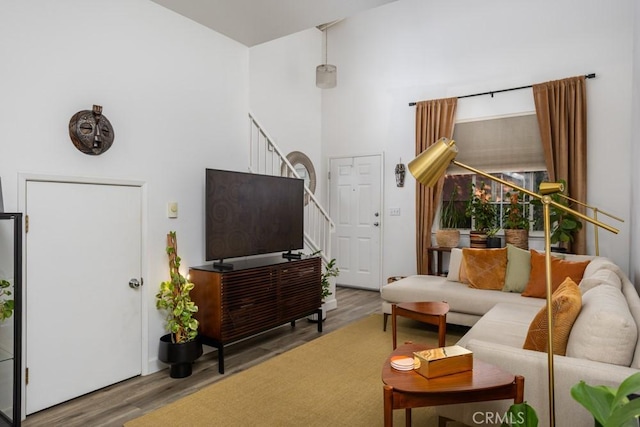 17 Carnegie, San Jose, CA 95116 - living room with wood finished floors, stairs, and a towering ceiling