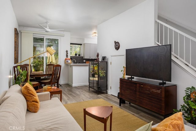 17 Carnegie, San Jose, CA 95116 - living room with wood finished floors, ceiling fan, and stairs