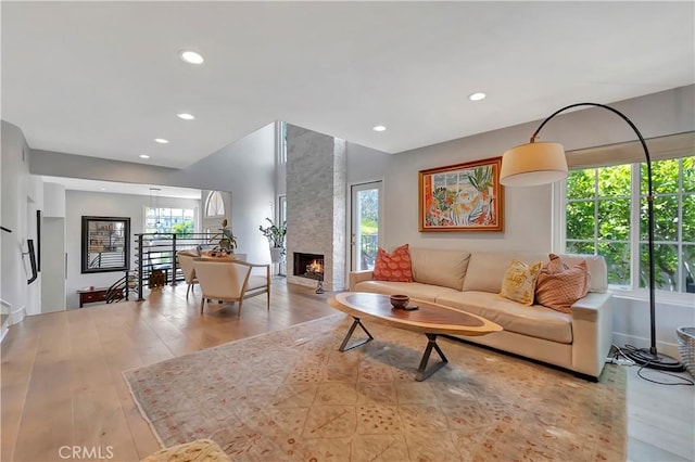 19325 Peachtree Ln, Huntington Beach, CA 92648 - living room with healthy amount of natural light, wood finished floors, recessed lighting, and a large fireplace