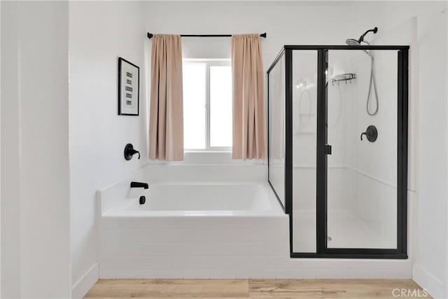12207 Snapping Turtle Rd, Apple Valley, CA 92308 - bathroom with a stall shower, a garden tub, and wood finished floors