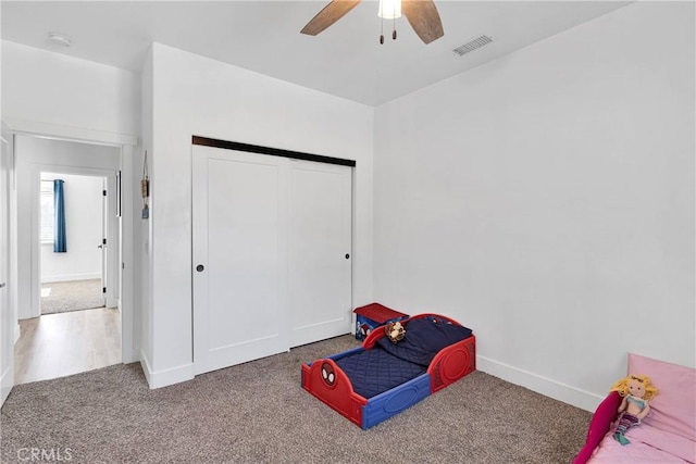 12207 Snapping Turtle Rd, Apple Valley, CA 92308 - bedroom with carpet, a closet, and ceiling fan
