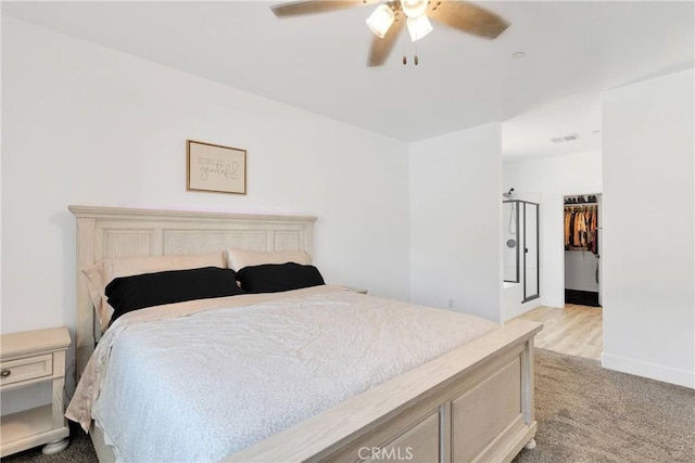 12207 Snapping Turtle Rd, Apple Valley, CA 92308 - bedroom featuring carpet flooring, ceiling fan, and a walk in closet