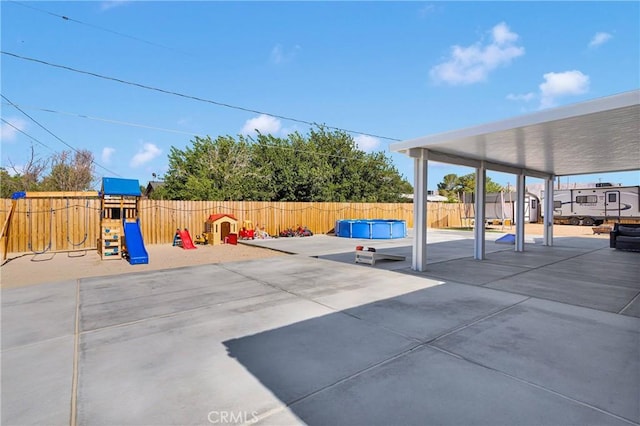 12207 Snapping Turtle Rd, Apple Valley, CA 92308 - fenced backyard with a playground and a patio