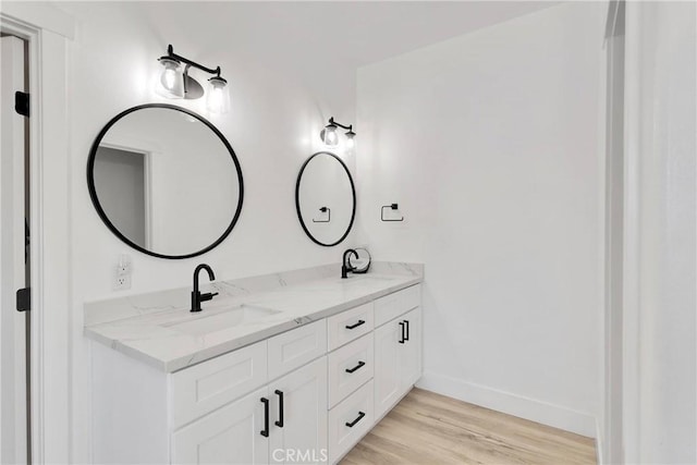 12207 Snapping Turtle Rd, Apple Valley, CA 92308 - bathroom featuring double vanity and wood finished floors