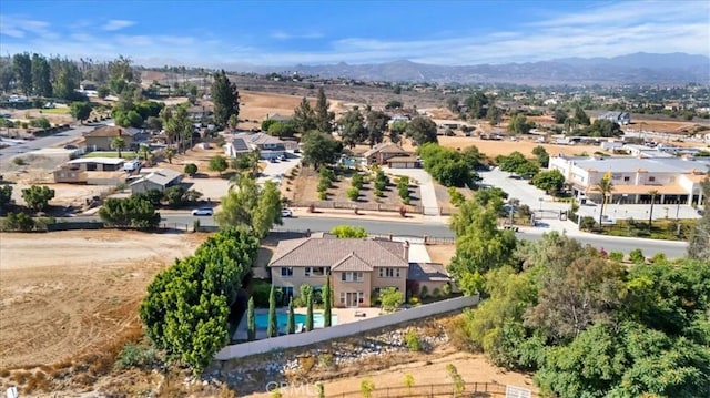 16858 Mariposa Ave, Riverside, CA 92504 - aerial perspective of suburban area featuring a mountain backdrop and a pool area
