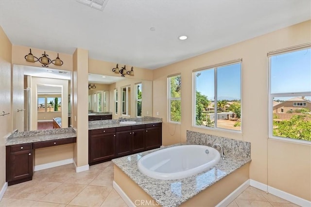 16858 Mariposa Ave, Riverside, CA 92504 - bathroom with a garden tub, healthy amount of natural light, and vanity