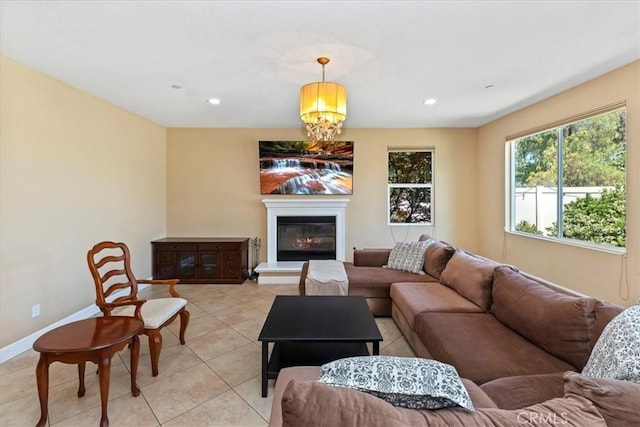 16858 Mariposa Ave, Riverside, CA 92504 - living room featuring light tile patterned floors, recessed lighting, a glass covered fireplace, and a chandelier