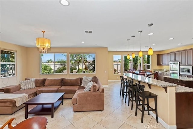 16858 Mariposa Ave, Riverside, CA 92504 - living area with light tile patterned flooring, a chandelier, and recessed lighting