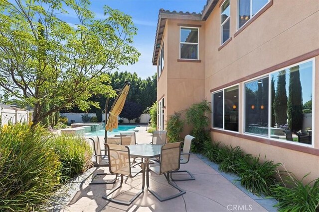 16858 Mariposa Ave, Riverside, CA 92504 - view of patio / terrace featuring a hot tub and outdoor dining area