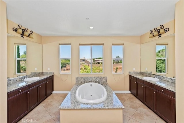16858 Mariposa Ave, Riverside, CA 92504 - full bathroom with two vanities, a garden tub, and tile patterned flooring