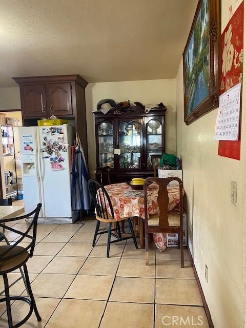 831 Alamitos Ave Unit 3, Long Beach, CA 90813 - dining area featuring light tile patterned floors