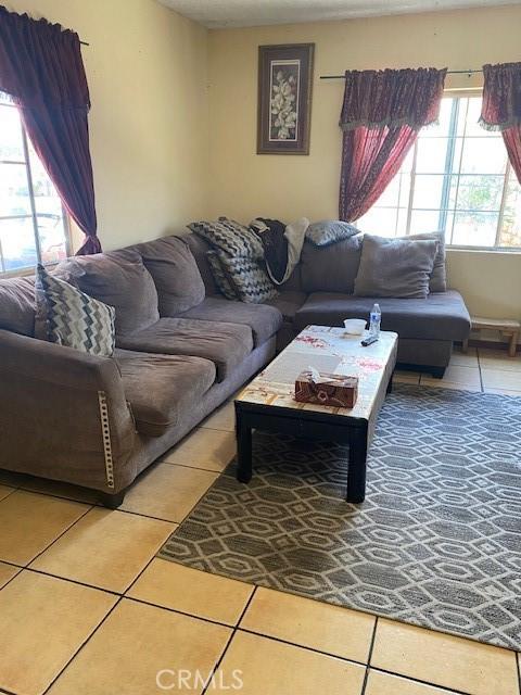 831 Alamitos Ave Unit 3, Long Beach, CA 90813 - living area featuring light tile patterned floors