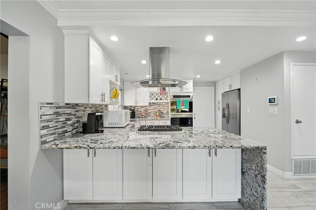 2007 Socrates Ave, Simi Valley, CA 93065 - kitchen with stainless steel appliances, island range hood, a peninsula, decorative backsplash, and white cabinetry
