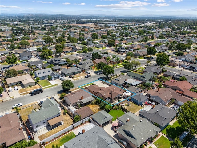8038 Cyclamen Way, Buena Park, CA 90620 - aerial perspective of suburban area with property parcel outlined and a mountainous background