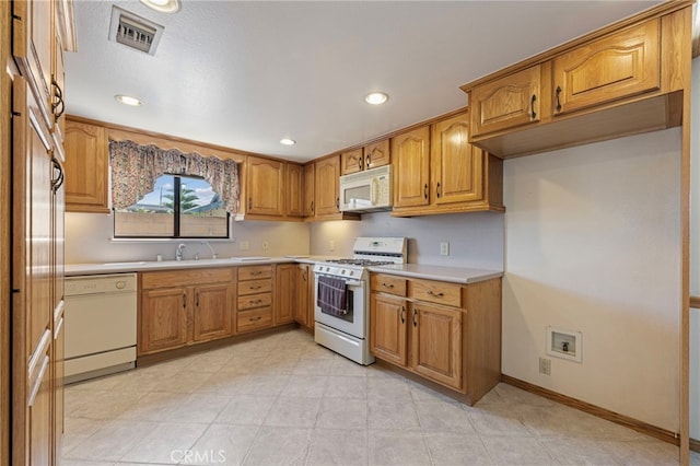 8038 Cyclamen Way, Buena Park, CA 90620 - kitchen featuring white appliances, brown cabinets, light countertops, and recessed lighting