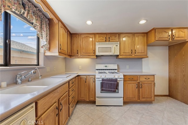 8038 Cyclamen Way, Buena Park, CA 90620 - kitchen with white appliances, light countertops, brown cabinetry, and recessed lighting