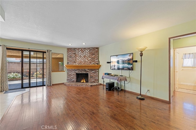 8038 Cyclamen Way, Buena Park, CA 90620 - living room with hardwood / wood-style flooring, a brick fireplace, and recessed lighting